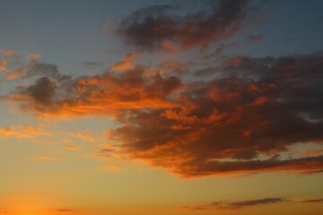 Naklejka na ściany i meble Sunset in the red clouds