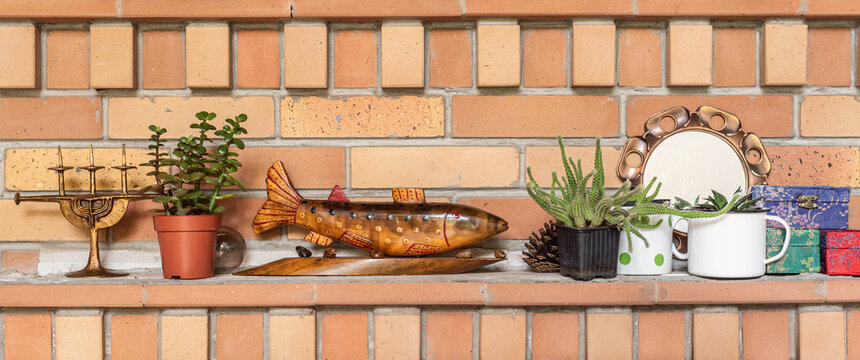 Fireplace Mantel With Wooden Fish Statue And Plants, Mid Century Modern Objects