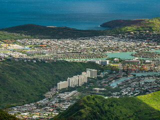 The view overlooking the town.  Blue sky over green mountains. Amazing view of the ocean. 
 Kuliouou Ridge Trail, Hawaii, Oahu