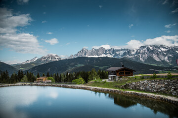 Fototapeta na wymiar Modern architecture under high mountains