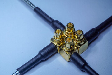 Close-up of gold plated MMCX radio network communications pigtail electronics component