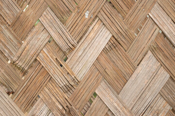 nature background of brown handicraft weave texture bamboo surface.