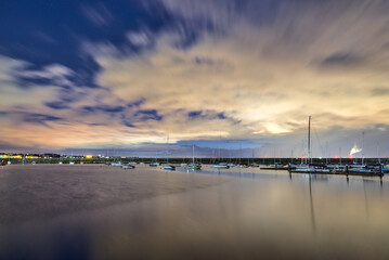 West pier of Dun Laoghaire harbor during the blue hour. Evening shot of well-known harbor in Dublin, Ireland