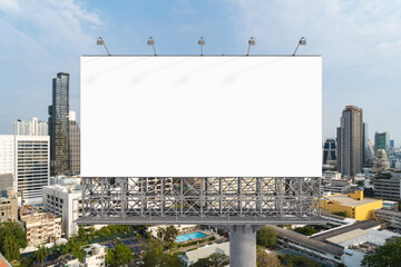 Blank white road billboard with Bangkok cityscape background at day time. Street advertising poster, mock up, 3D rendering. Front view. The concept of marketing communication to promote or sell idea.