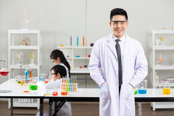 Portrait young asian science teacher in laboratory classroom