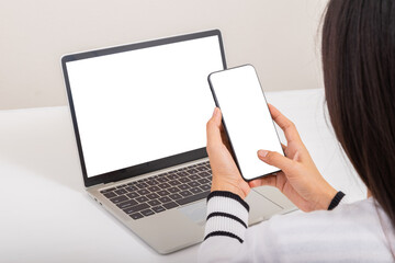 Online Shopping Concept. Women use smartphone with credit card to payment after shopping from laptop