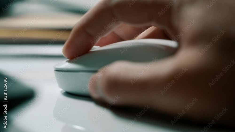 Poster White computer mouse on a work desk. Working with a PC and click on the mouse. Footage of the workplace in 4K