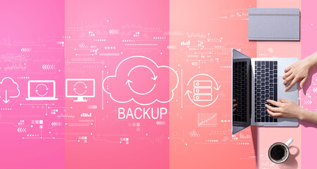 Backup concept with person working with a laptop