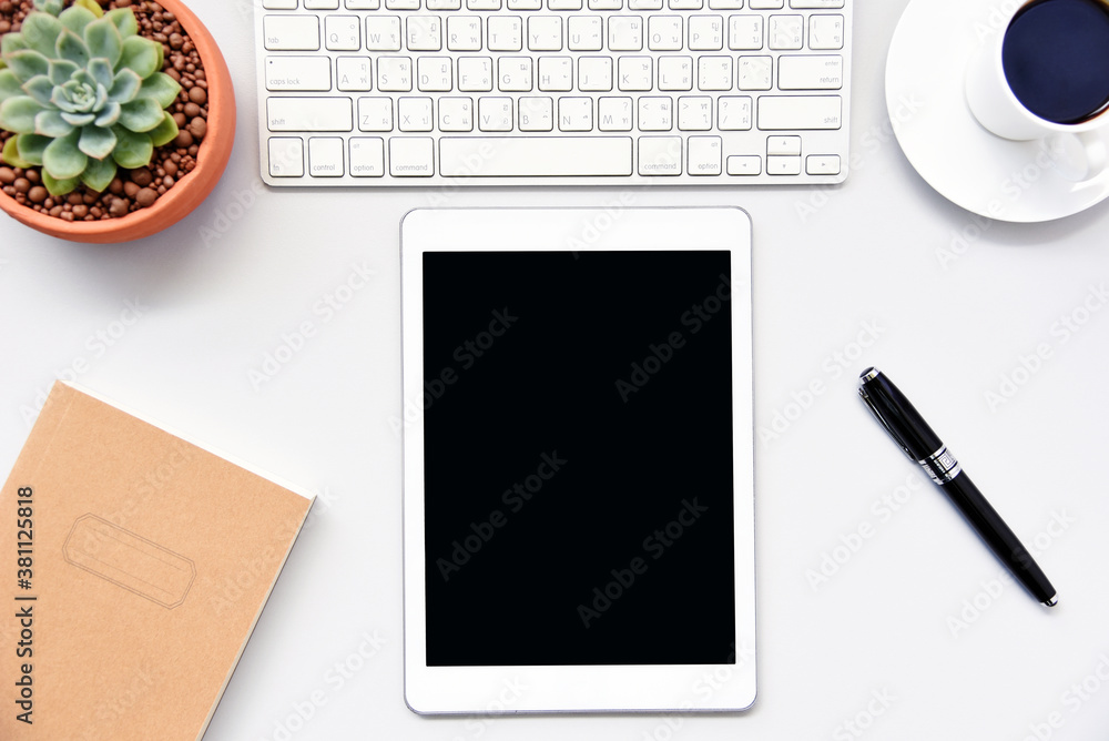 Poster top view tablet,and keyboard on office desk with copy space.