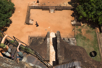 Tourist climbing down the stairs from Lions Rock, Sigiriya, Sri Lanka