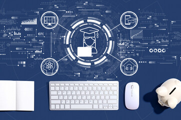 Distance learning theme with a computer keyboard and a piggy bank