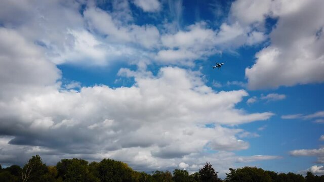 Airplane take off from Heathrow above Runnymede on sky -  4k footage