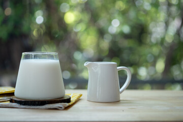 Glass of fresh milk with saucer