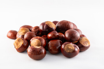 isolated pile of chestnuts kastanien 