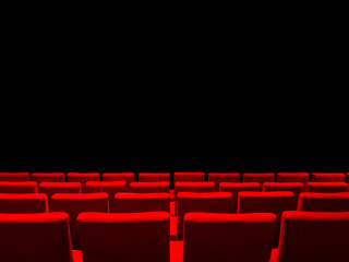 Obraz premium Cinema movie theatre with red seats rows and a black background