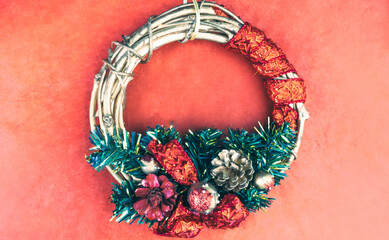 Christmas wreath on the red background