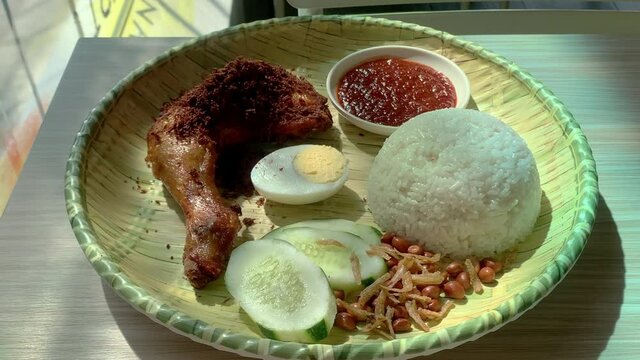 Nasi Lemak with fried chicken. Coconut rice, a popular cuisine in Malaysia and Indonesia.