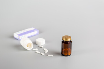 Various medicine bottles and different pills