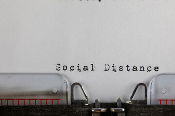 written on old typewriter with text Social Distance. Covid-19, Coronavirus concept