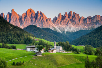 View of Val di Funes or Villnöß during sunset with Santa Magdalena church and Enrosadira or...