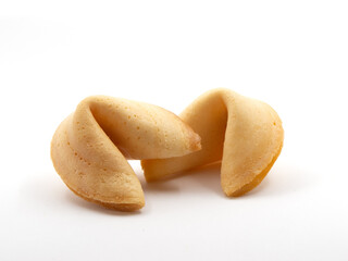 Two unopened fortune cookies on white background