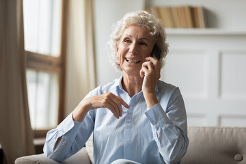 Thank you for help. Happy positive older woman consulting by phone with doctor, lawyer or bank...