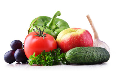 Composition with fresh vegetables and fruits isolated on white