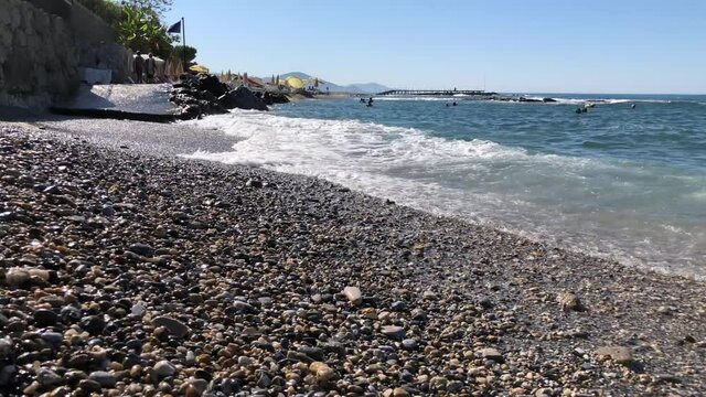 Waves on the rocky sea beach of a Turkish resort