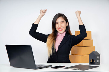 Asian woman entrepreneur/ Business owner working at home for online shopping