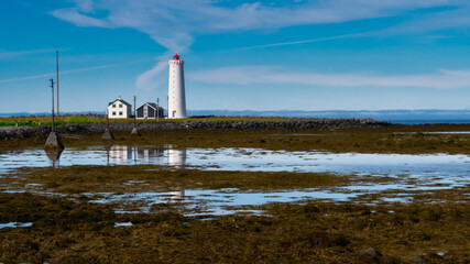 Lighthouse on the island of Grótta near Reykjavik, Iceland. The island is accessible via a causeway at low tide.