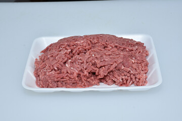 fresh organic mutton mince meat decorated in plate on white background