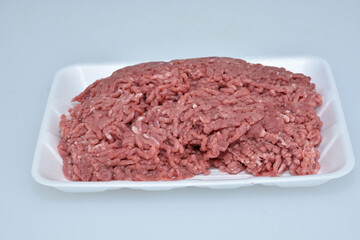 fresh organic mutton mince meat decorated in plate on white background