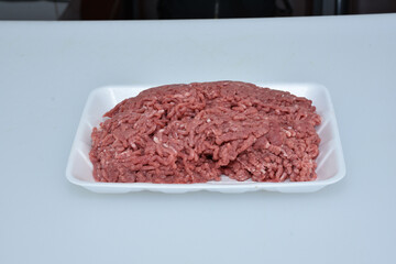 fresh organic mutton mince meat decorated in plate on white background