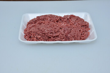 fresh organic mutton mince meat decorated in plate on white background