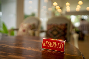 Naklejka na ściany i meble restaurant reservation sign on table 
