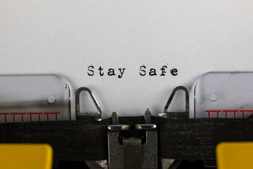 written on old typewriter with text Stay safe. Covid-19, Coronavirus concept