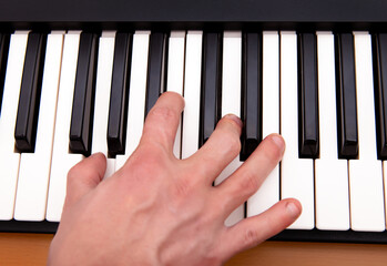 Hand and Piano Keyboard