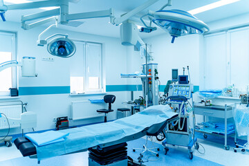Modern operating room with advanced equipment, special medical devices. Hospital room interior.