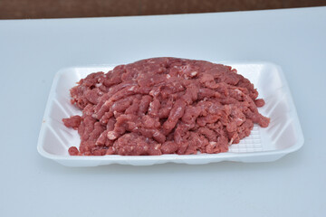 fresh organic mutton mince meat decorated in plate on white background