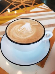 cup of coffee on wooden table