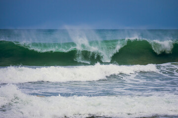 Powerful blue ocean wave with perfect breaking natural background