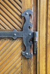 An old decorative metal door hinge