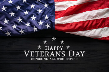 Happy Veterans Day. American flag on black wooden background with copy space.