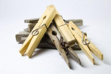 Clothespin made of wood on a white background