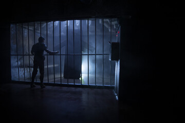 Fototapeta na wymiar Old prison bars cell lock. Creative artwork decoration. Old grunge prison interior.