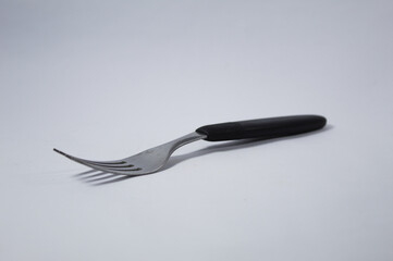 Metal fork with white background
