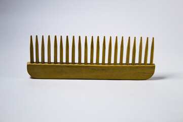 Wooden comb with white background