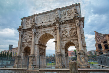 Fototapeta na wymiar Arch of Constantine, (ad 312), one of three surviving ancient Roman triumphal arches in Rome. Arch of Constantine or Arco di Costantino or Triumphal arch in Rome, near Colosseum, Italy