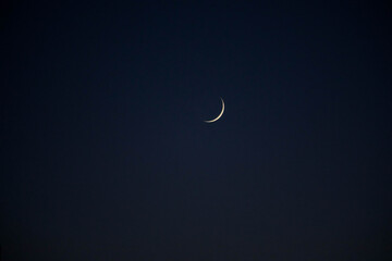 Obraz na płótnie Canvas Crescent moon in a dark blue sky without stars