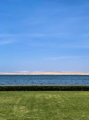 Paracas, bay and natural reserve of Ica in Peru Sea, water, birds, dock, stones.